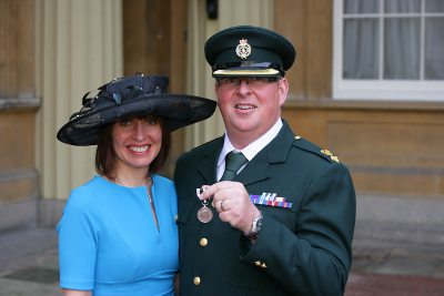 Dave Bull QAM, with wife Kate and today's investiture