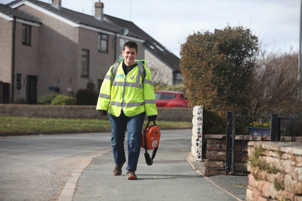 Community First Responder walking down residential street